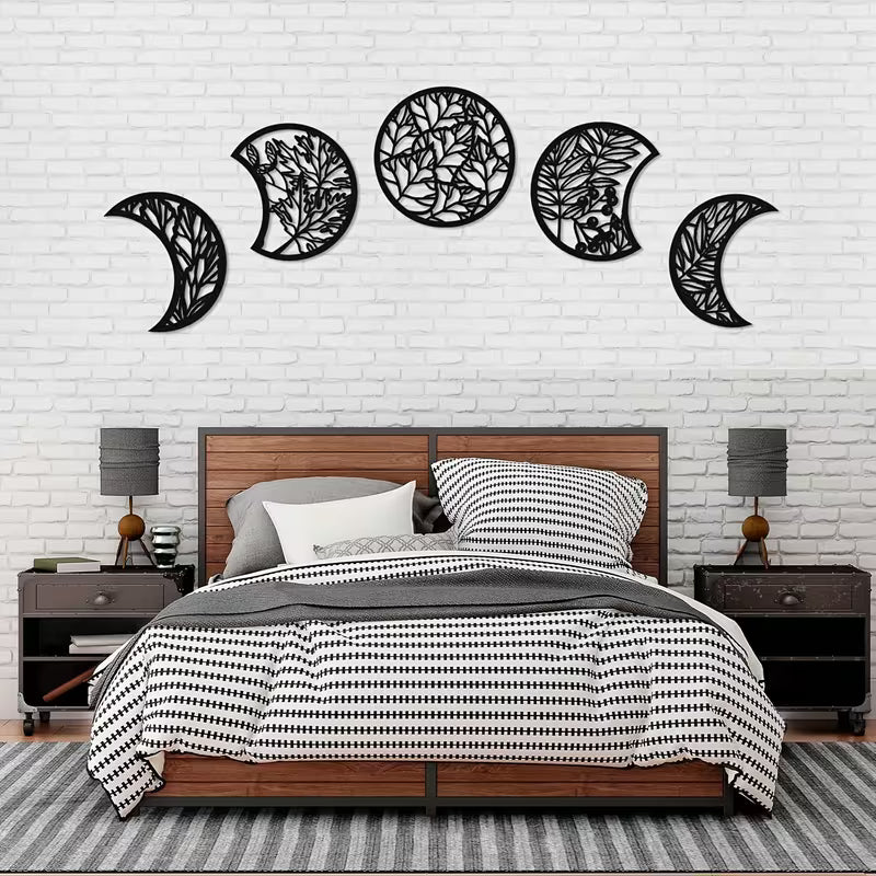 Bedroom with decorative wall art resembling moon phases on a white brick wall.